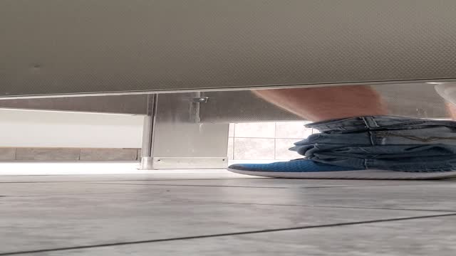 Under stall blowjob