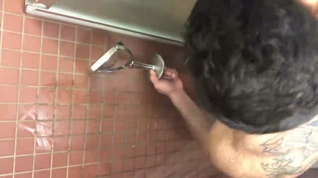 Muscle hunk solo showering