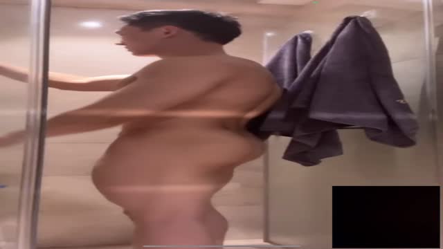 Chinese bodybuilder showering