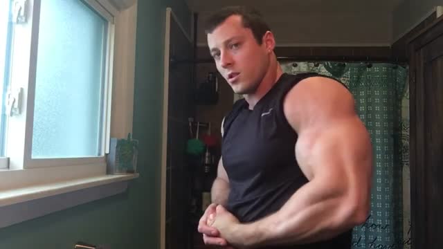 Muscle guy flexing