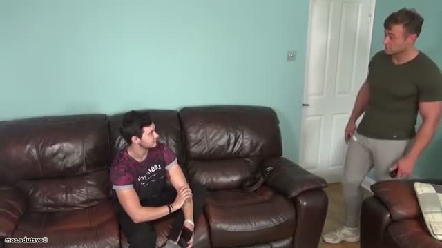 Hunk spanking a lad