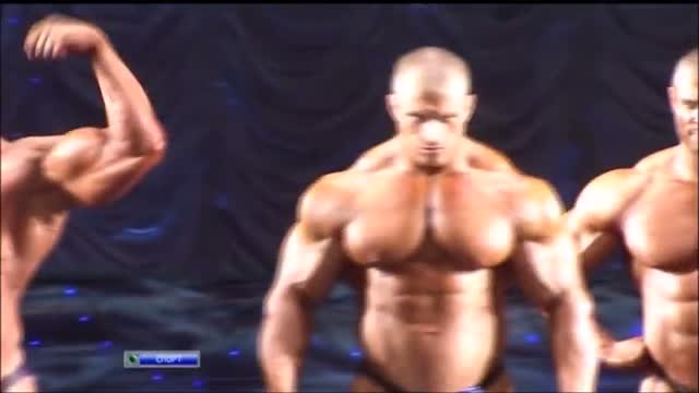 Big bodybuilders posing at the Grand Prix Baikal 2011