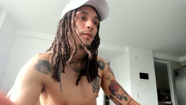 Tattooed Guy With Locs Plays With His Uncut Dick