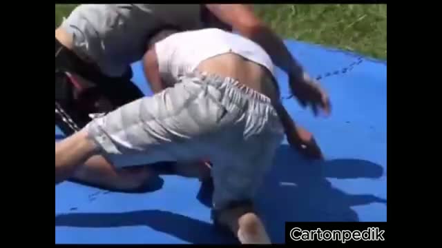 Muscular village boys wrestle