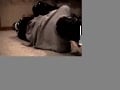 Hogtied, gagged, hooded, struggling