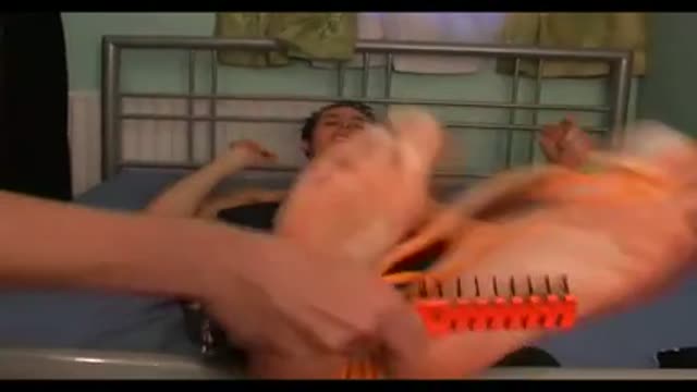 Dave Tickled on Bed