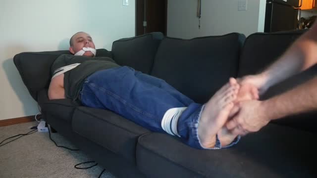 Tied up on a sofa & tickled