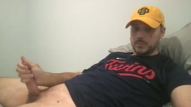 Cap Guy Wanking and Cumming on His Belly