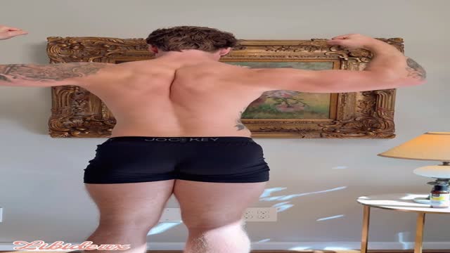 handsome guy spreads his legs and strokes his big cock