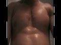 oily muscle flexing
