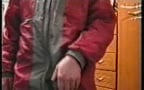wanking in a gray nylon  jacket with red linning