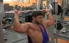 HOT bodybuilder in singlet works out
