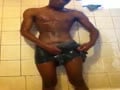Black college guy showering