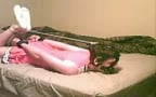 Crossdressing twink tied up struggling on bed