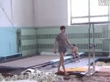 Teen gymnast flexes