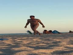Naked beach. Hung older man walking 