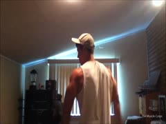 young muscle hunk flexing