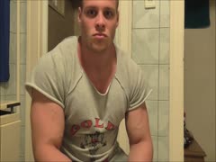 beefy muscle hunk flexing