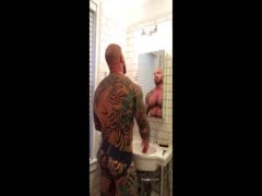 Tattooed Muscle bear shows off
