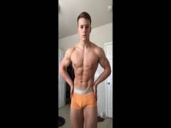 young muscle hunk flexing