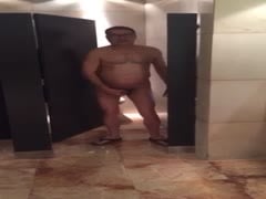 Playing in a public toilet