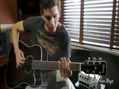 Stroking his guitar and cock