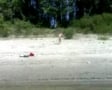 NAKED SEASIDE PADDLER