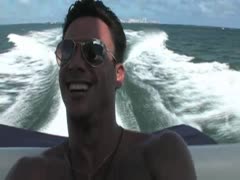 Javier naked on a boat
