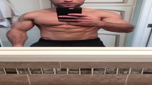 College Dude Flexing in the Mirror
