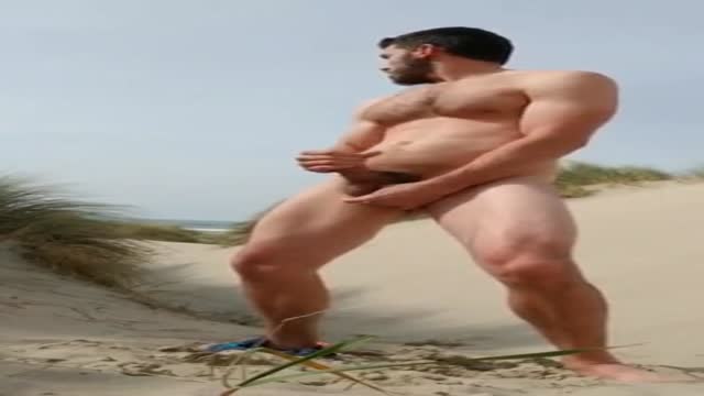 muscle guy cums on beach