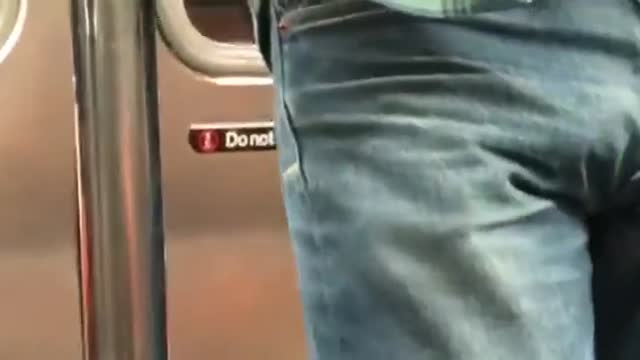 Builder travels. He touches the bulge. He pulls it out.