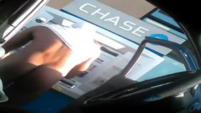 Exhibitionist getting money from the ATM machine