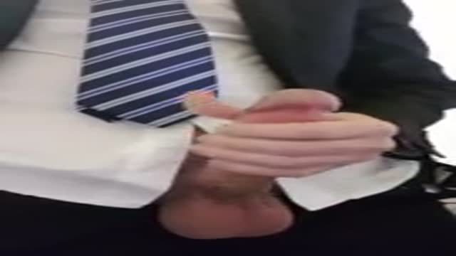 wank in public in a business suit