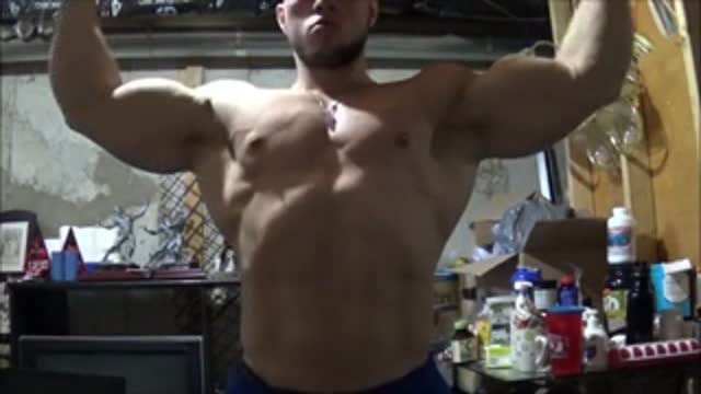 Cocky bodybuilder flexing