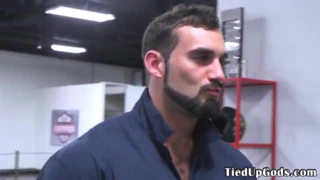 Buff BDSM sub gagged and restrained