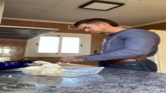 Juan Lucho shows off while making breakfast 