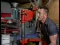 three men in a work shop