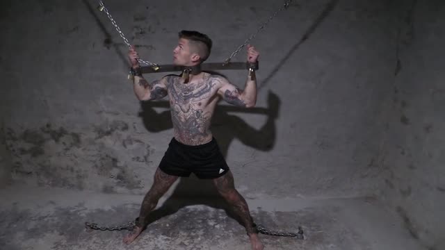 Locked in chains in basement