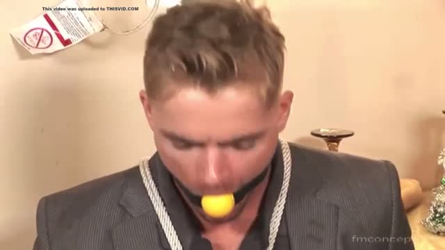 Hot guy in a suit tied up and gagged