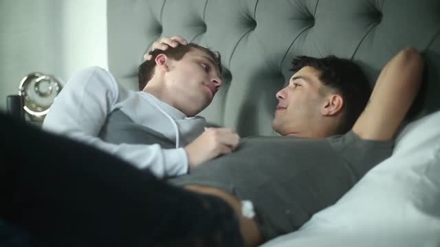 Handsome couple on bed