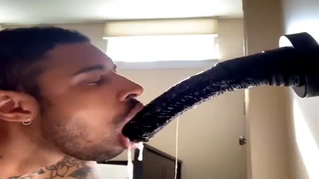 Gagging on a dildo