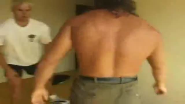 Long haired guy wrestles