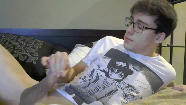 Nerdy guy shoves a dildo up his hole while wanking