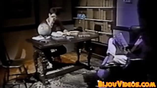 Nerdy college students blow each other in the library